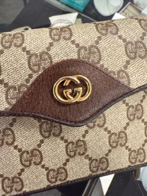 Pre Owned Gucci Monogram Mini Pouch with Gold GG Front