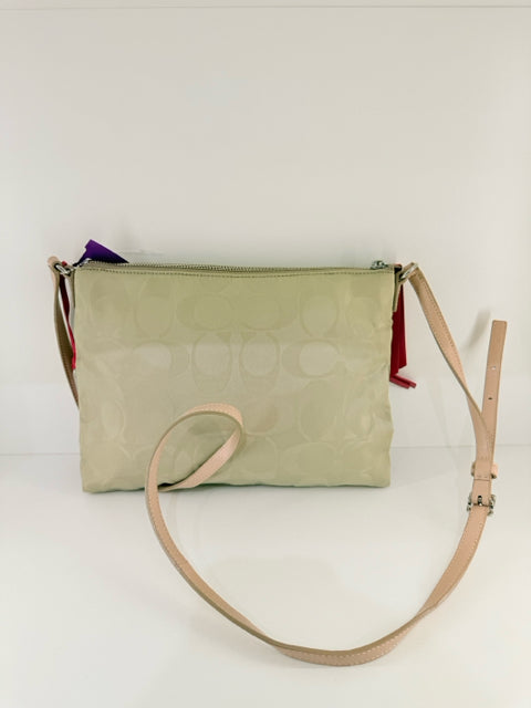 Pre Owned Coach Nylon Beige All over logo w/pink straps/trip Cross Body