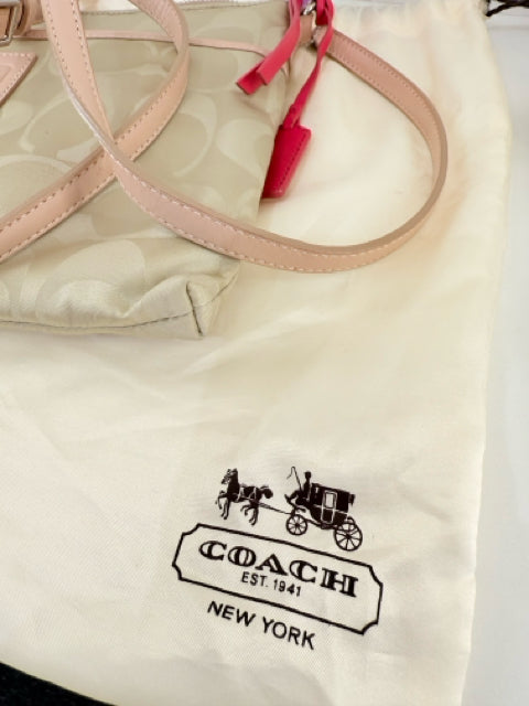 Pre Owned Coach Nylon Beige All over logo w/pink straps/trip Cross Body
