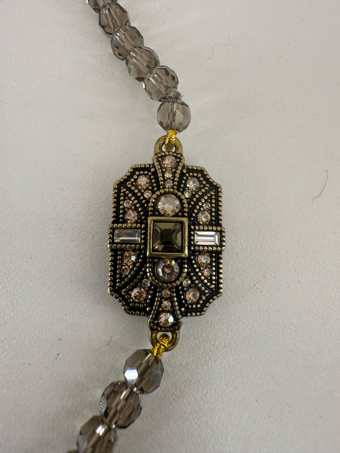 Heidi Daus HSN Vintage Deco Trilogy Crystal Pendant 4 station smoky quartz toggle Necklace