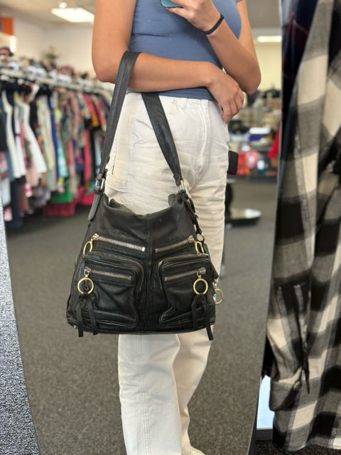 Chloe Black Leather Multi Silver Shoulder Satchel Bag

Multi silver zipper pockets shoulder satchel

Silver and gold toned hardware