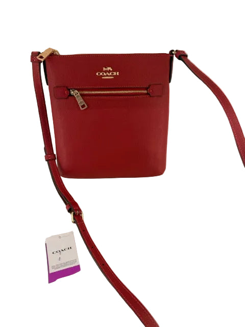 NWT Coach Mini Pebbled Red Leather Rwn File Cross Body
zip closure and adjustable strap
vibrant red color
polished gold hardware size
9" T x 8" W x 1" FLAT