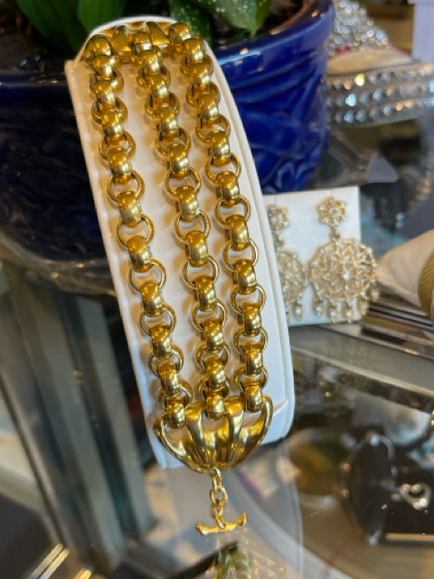 Robert Lee Morris Bracelet Gold Tone 

3 strand gold links w/triangle duck feet ends T toggle