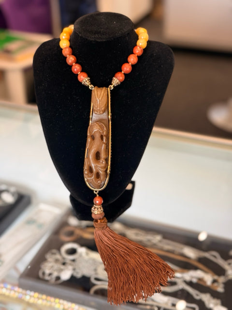 Heidi Daus Carved serpent dragon w Tassel  Rust orange 7 clear beads Necklace