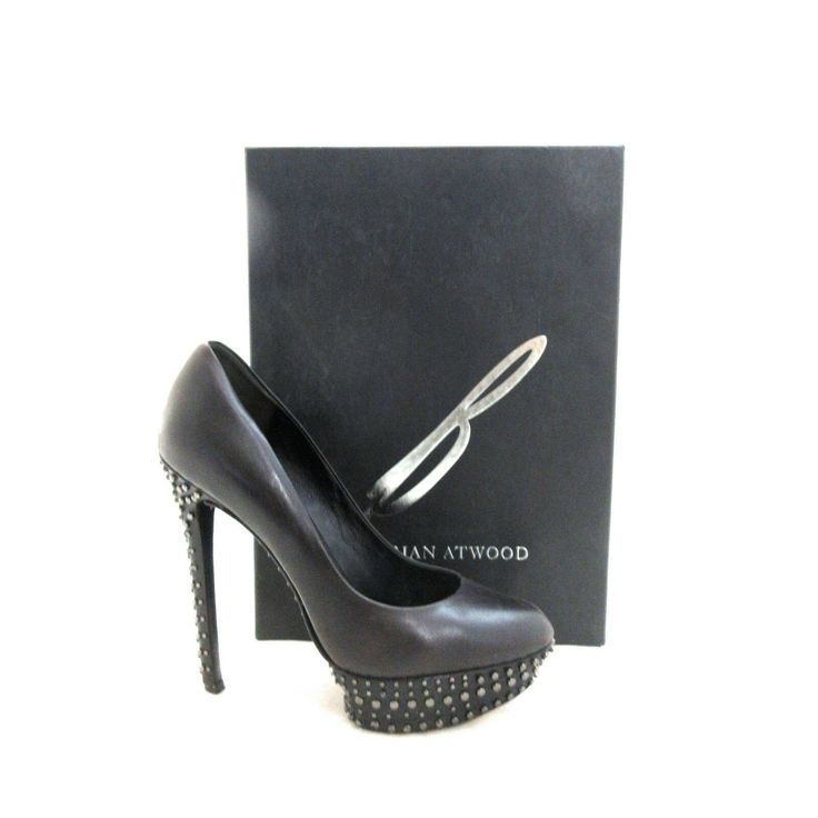 NIB New In Box Finvarra Studded Platform Pump  
Modern metal peppers the platform and heel of a sleek leather pump with undeniable edge.